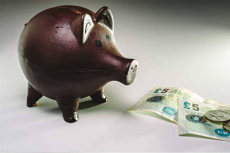 piggy bank with pound notes